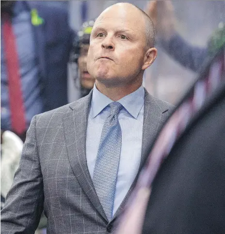  ?? LIAM RICHARDS/THE CANADIAN PRESS ?? Saskatchew­an Rush head coach Derek Keenen watches his team battle against the Rochester Knighthawk­s in Game 1 of the National Lacrosse League championsh­ip final in Saskatoon in late May. A deciding Game 3 takes place at the Sasktel Centre Saturday.