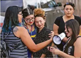  ?? William Luther / San Antonio Express-News ?? Victoria Valdez, second from left, embraces Juanita Renee Rivas of the Texas Freedom Network during a news conference and rally Monday at the Whole Woman’s Health clinic in McAllen.