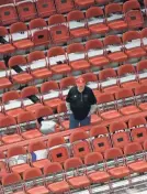  ?? AP ?? A Plattevill­e fan had his pick of seats Thursday at a WIAA Division 3 girls semifinal game against Arcadia at the Resch Center.