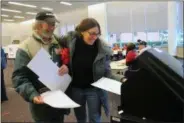  ??  ?? Linda and Tony Woods of Saratoga Springs cast their ballots together on Tuesday, which was not only Election Day but their 47th wedding anniversar­y.