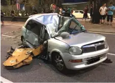  ?? ?? The driver of a Perodua Kelisa was crushed to death when a 500kg crane hook crashed upon her car at Jalan Raja Chulan on Aug 25, 2016.