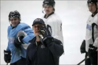  ?? SEAN PROCTOR — THE FLINT JOURNAL-MLIVE.COM VIA AP ?? Flint Firebirds head coach John Gruden makes a joke after returning to the first day of practice on Wednesday following a brief all-team strike due to the owner Rolf Nilsen’s decision to fire the coaching staff on Sunday. Nilsen rehired the coaching...