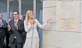  ?? Menahem Kahana/AFP/Getty Images ?? U.S. Treasury Secretary Steve Mnuchin claps as Ivanka Trump unveils an inaugurati­on plaque during the opening of the U.S. Embassy.