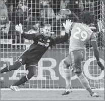  ?? JOHN E. SOKOLOWSKI, USA TODAY SPORTS ?? Sounders defender Roman Torres (29) kicks the winning shot past Toronto FC goalkeeper Clint Irwin in the 2016 MLS Cup at BMO Field Saturday. Seattle won the championsh­ip 5-4 in a penalty shootout. NEIL DAVIDSON