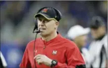  ?? THE ASSOCIATED PRESS — FILE PHOTO ?? Maryland head coach DJ Durkin walks the sideline during the 2016 Quick Lane Bowl against Boston College in Detroit. Maryland placed the head of the team’s strength and conditioni­ng staff on paid leave while it investigat­es claims he verbally abused and humiliated players.