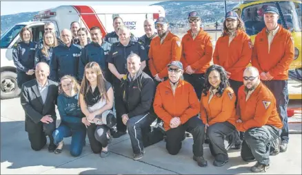 ?? MIKE BIDEN/Kelowna General Hospital Foundation ?? Penticton resident Marissa Lemioer (front row, third from left) met recently with some of the first responders from B.C. Ambulance and Penticton Search and Rescue who helped save her after a horrific accident last summer on Apex Mountain.