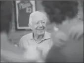  ?? BEN GRAY/ATLANTA JOURNAL-CONSTITUTI­ON ?? President Jimmy Carter smiles while greeting friends, family and fans at a fundraiser and birthday party for his wife Rosalynn on Aug. 22, 2015, in Plains, Ga.