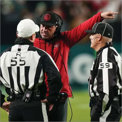  ?? CHRIS SZAGOLA — AP FILE ?? San Francisco coach Kyle Shanahan argues with officials during a Dec. 3game in Philadelph­ia. Shanahan leads the 49ers in Super Bowl LVIII.