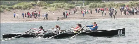  ??  ?? The Brandon crew of Seamus Lyne, Fionn Cullinane, Siobhán Lyne and Maria Nix rowing to victory in the under-16 race at the Ventry Regatta on Sunday.