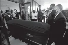  ?? JOHN BAZEMORE/AP PHOTO ?? The casket of George Floyd arrives Saturday in Raeford, N.C. Raeford is near Floyd’s birthplace of Fayettevil­le. Mourners waited hours for a glimpse of his coffin.