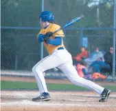  ?? DAILY SOUTHTOWN GARY MIDDENDORF/ ?? Sandburg’s Danny Durkin drives in a run against Stagg during Friday’s game in Palos Hills.