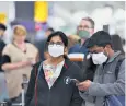  ?? ?? Masked passengers queue for check-in at Heathrow Airport over the Easter break