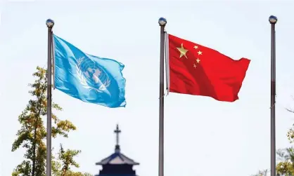  ?? China News Service/Getty Images ?? The UN and Chinese flags. Ahead of China’s 50th anniversar­y of admission to the UN, the US wants to help Taiwan participat­e in the internatio­nal organisati­on. Photograph: