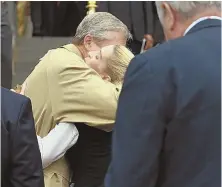  ??  ?? HONORED: Gov. Charlie Baker hugs Sonia ‘Tita’ Puopolo, daughter of Sonia Mercedes Morales Puopolo, who was killed in the Sept. 11 attacks, yesterday. Ryan Saba, 24, below, and Ray Armistead, 25, receive the Sweeney Award for Civilian Bravery presented by Rose Perkins yesterday.