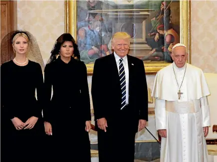  ?? PHOTO: REUTERS ?? Pope Francis poses with US President Donald Trump ,his wife Melania and Ivanka Trump during a private audience at the Vatican.