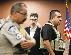  ?? BRIANA SANCHEZ / EL PASO TIMES FILE ?? The government has filed hate crime charges against Patrick Crusius, 21, center, who said he targeted Mexicans and shot to death 22 people at a Walmart store in El Paso, Texas, on Aug. 3.