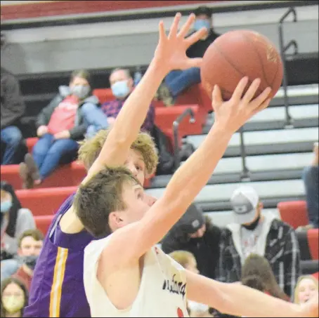  ?? RICK PECK/ SPECIAL TO MCDONALD COUNTY PRESS ?? McDonald County’s Pierce Harmon scores despite the defense of Monett’s Ben Hoyt. Harmon finished with 24 points to lead the Mustangs in their 66-53 loss to the Cubs on Jan. 8 at MCHS.