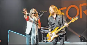  ?? Krishta Abruzzini ?? Vocalist Kelly Hansen, left, and bassist Jeff Pilson return with Foreigner when the band resumes its series at the Venetian Theatre.