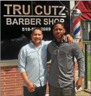  ??  ?? Lamont Washington and Henry Jenkins will provide free haircuts September 3 through September 5 at Tru Cutz Barbershop for students.