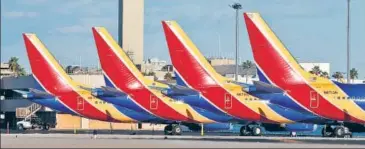  ?? AFP ?? Boeing 737 Max 8 passenger planes are seen on the tarmac at Phoenix Sky Harbor Internatio­nal Airport in Phoenix, US.