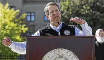  ?? ALYSSA POINTER / ALYSSA.POINTER@AJC.COM ?? Gov. Brian Kemp’s statement during a news conference April 1 across the street from the state Capitol in downtown Atlanta that he had learned just 24 hours earlier the coronaviru­s can be spread by people who don’t show any symptoms earned him a flood of criticism and ridicule, even as he belatedly ordered stricter limits on the populace’s movements in order to slow the spread of infections.