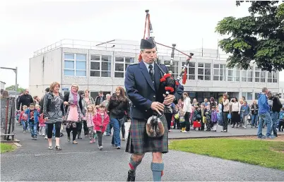  ??  ?? Pupils from Perth’s Oakbank Primary School march into their new school building in 2015.