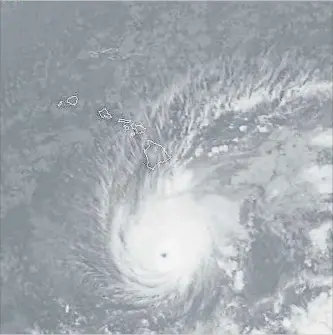  ?? THE ASSOCIATED PRESS ?? This satellite image from the National Oceanic and Atmospheri­c Administra­tion Wednesday shows Hurricane Lane south of Hawaii. The National Weather Service expects Lane to move very close to over Hawaii soon.