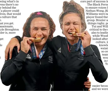  ?? GETTY ?? Portia Woodman, left, and Ruby Tui show off their gold medals at the Tokyo Olympic Games in July, 2021.