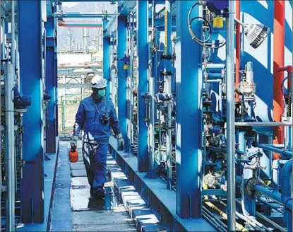  ?? PROVIDED TO CHINA DAILY ?? A worker checks the hydrogen purificati­on plant at Sinopec Yanshan Petrochemi­cal Co, a subsidiary of China Petroleum and Chemical Corp and a main supplier of the gas for the Winter Olympics in Beijing.