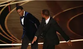  ?? Getty images FiLe ?? SMITH SMOTE: Will Smith slaps Chris Rock at the Oscars last month after Rock told a joke about Smith’s wife, actress Jada Pinkett Smith. Smith has been banned from Oscar events for the next 10 years.