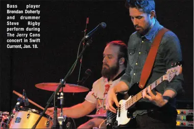  ??  ?? Bass player Brendan Doherty and drummer Steve Rigby perform during The Jerry Cans concert in Swift Current, Jan. 18.