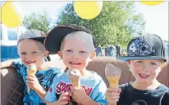  ??  ?? Cars and ice cream: Taylor Laird, 6, Benny Laird, 4, and Jayden Smith, 5, enjoy a treat at the Matamata Car-O-Rama on Saturday.