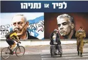  ?? ODED BALILTY AP ?? Signs depict Prime Minister Benjamin Netanyahu (left) and rival Yair Lapid in Ramat Gan, Israel.