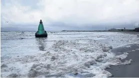  ??  ?? All ashore The buoy which washed up on Ayr beach