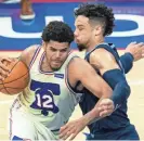  ?? CHRIS SZAGOLA/AP ?? Philadelph­ia 76ers' Tobias Harris, left, makes his move against Memphis Grizzlies' Dillon Brooks, right, during the first half of a game on April 4 in Philadelph­ia.