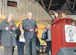  ?? SPECIAL TO THE EXAMINER ?? Longtime volunteers and supporters Joan and Bruce Payne cut the ribbon to officially open the 151st Norwood Fair. Norwood’s renowned Fall Fair has been a tradition in the village since 1868.