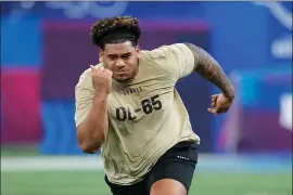  ?? DARRON CUMMINGS — THE ASSOCIATED PRESS ?? Brigham Young offensive lineman Kingsley Suamataia runs a drill at the NFL scouting combine on Sunday, March 3, 2024 in Indianapol­is.