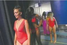  ??  ?? The Miss Black America Pageant casts the swimsuit competitio­n as a way to celebrate positive body images.