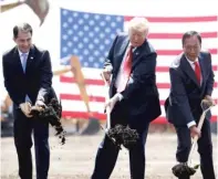  ?? EVAN VUCCI/AP ?? LEFT: Wisconsin Gov. Scott Walker (from left), President Trump and Foxconn chairman Terry Gou break ground on the future factory.