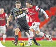  ??  ?? Steven Gerrard in action against Santi Cazorla