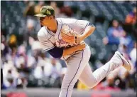  ?? David Zalubowski / Associated Press ?? Mets starting pitcher Carlos Carrasco works against the Rockies in the first game of a doublehead­er Saturday in Denver.