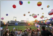  ?? DAVE WEAVER — THE ASSOCIATED PRESS ?? Fans play with beach balls during the 2012 College World Series.