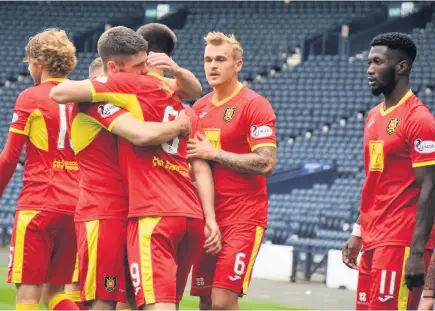  ??  ?? Strike Euan East celebrates with the Albion Rovers players after his goal against Queen’s Park