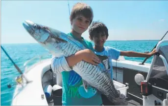  ??  ?? Shaun Morgan with a 10kg mackerel caught on a trip with Samuel Hastie