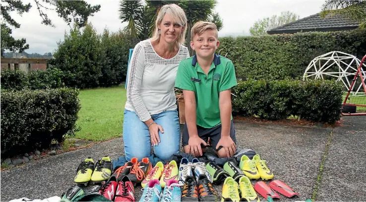  ?? PHOTO: AMY BAKER/FAIRFAX NZ ?? Tracy Benge and son Mason, 10, of Greenhithe are now collecting unused boots, sportshoes and sportsgear to give away in September.