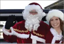  ?? COURTESY PHOTO ?? Santa and Mrs. Claus greet families at the Fontana Unified School District’s 25th annual Fontana Santas event, held Dec. 17in the district office parking lot.