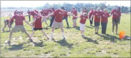  ??  ?? The Wills Group employees participat­e in team-building exercises with Farming 4 Hunger at Serenity Farm in Benedict on May 17.