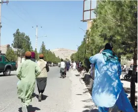  ?? / AP ?? EXPLOSION. People run near the site of an explosion in Herat, Afghanista­n, on Friday, Sept 2, 2022. Taliban officials and a local medic say an explosion tore through a crowded mosque in the western province, killing more than a dozen people, including a prominent cleric.