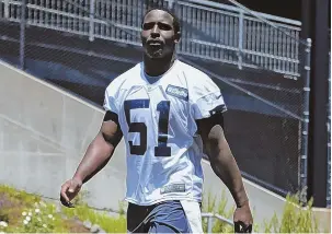  ?? STAFF PHOTO BY NANCY LANE ?? RUNNING THEME: First-round pick Sony Michel walks onto the practice field at Gillette Stadium before yesterday’s OTAs.