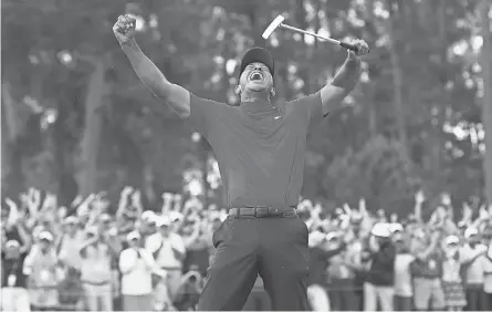 ?? ROB SCHUMACHER/ USA TODAY SPORTS ?? Tiger Woods celebrates winning the 2019 Masters tournament in Augusta, Ga.
